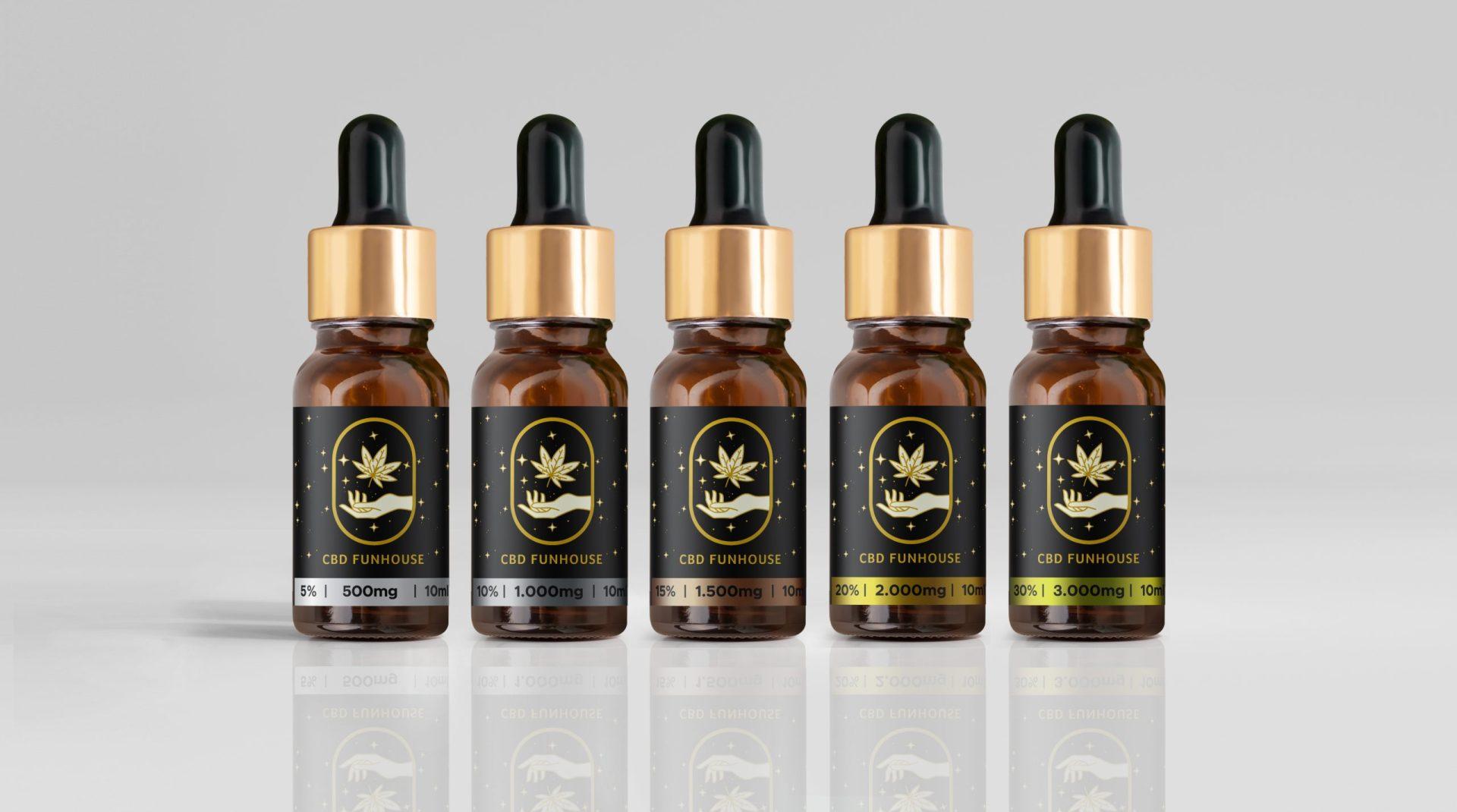 Colecție completă de cinci sticluțe ulei CBD în diverse concentrații de canabidiol.